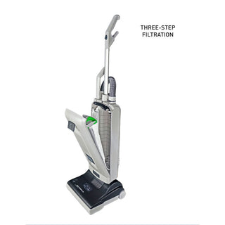 The SEBO ESSENTIAL G4 from Sew & Vac is an upright vacuum cleaner with a handle and hose, showcasing its open dust compartment. The text highlights "Three-step filtration," underscoring its effectiveness in removing pet hair.