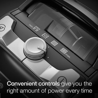 A close-up of the 2-Miele Boost CX1 Cat & Dog’s control panel shows a central dial with clearly labeled settings; text reads, “Convenient controls deliver just the power you need every time.” Designed for effortless pet hair removal, this bagless vacuum cleaner from 2-Miele guarantees efficient and easy cleaning.