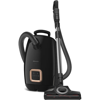 The Miele Guard L1 Cat & Dog canister vacuum cleaner by Miele features a handle, flexible hose, telescopic wand, and floor head attachment—ideal for pet hair removal and engineered as a highly efficient cat and dog vacuum.