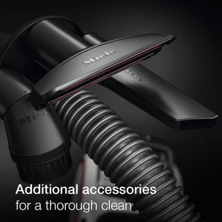 Close-up of 2-Miele Boost CX1 Pure Suction vacuum cleaner accessories, including a brush, crevice tool, and hose—featuring the advanced AirClean filter—for extra attachments and a superior clean.