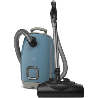A blue 2-Miele Guard L1 Electro bagged canister vacuum with an AirClean Filter, flexible hose, handle, and black floor attachment is shown against a white background.