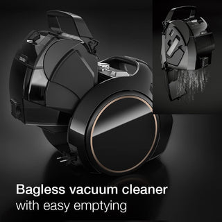 2-Miele Boost CX1 Cat & Dog bagless vacuum cleaner in black, shown with its dust compartment open for easy emptying as debris falls out; text reads “Bagless vacuum cleaner with easy emptying and effective pet hair removal.”.