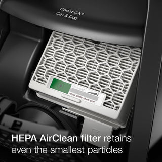 Close-up of a HEPA AirClean filter inside the 2-Miele Boost CX1 Cat & Dog, with text stating it captures even the tiniest particles for effective pet hair removal.