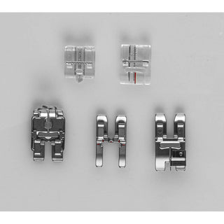 Five assorted presser feet for Sew & Vac’s Pfaff Quilt Ambition 635—two clear plastic feet on top and three metal feet below—are arranged on a plain gray background, ideal for quilting projects.