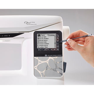A hand uses a stylus to browse fabric and technique options on the Husqvarna Viking Opal 690Q's touchscreen, highlighting its exclusive SEWING ADVISOR® feature.