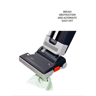 The Sew & Vac SEBO 350 Mechanical is a commercial-grade vacuum cleaner designed with a brush obstruction and automatic shut-off feature, making it ideal for removing pet hair. It is displayed with a cloth partially caught in the brush.