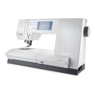 The Imagine Sewing & Vacuum Pfaff Expression 710 SPECIAL EDITION sewing machine features a digital display, function buttons, and the Original IDT System, shown in white at an angle on a white background.