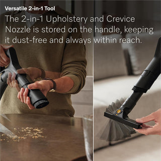 A person attaches the 2-in-1 upholstery and crevice nozzle to the handle of the Miele Guard L1 Cat & Dog canister vacuum by Miele, cleaning crumbs from a table. The text details the nozzle’s convenient storage features, making it ideal for quick cleanups and efficient pet hair removal.