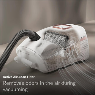 The 2-Miele Guard L1 AllFloor is a bagged vacuum cleaner with a transparent section that displays airflow and filtration, showcasing its advanced AirClean Plus filtration for superior odor removal and highlighting the vacuum’s powerful performance.