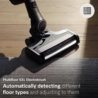 On the edge between hardwood and carpet, the Miele Triflex HX2 Pro 3-in-1 Cordless Stick Vacuum by Miele automatically detects and adjusts to different floor types, featuring a versatile 3-in-1 design and an advanced HEPA Lifetime Filter for improved air quality.