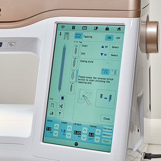 A Baby Lock Altair 2 Sewing & Embroidery Machine with a touch screen on it.
