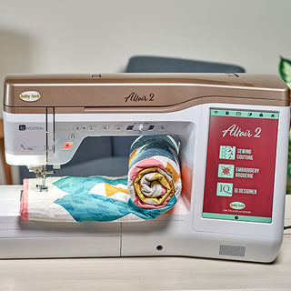 A Baby Lock Altair 2 Sewing & Embroidery Machine with IQ Technology, showcasing a quilt on it.