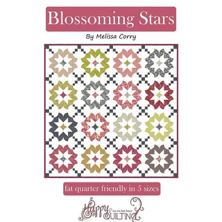 Cover of a quilting pattern book titled "Blossoming Stars" by Sew & Vac, featuring a quilt with star-shaped patterns. Subtext mentions "fat quarter friendly in 5 sizes" and incorporates strip piecing techniques.