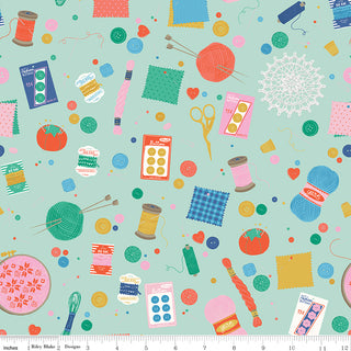 Hand Made by Riley Blake C16590-MINT Notions Mint Fabric by Riley Blake features sewing notions—spools, buttons, needles, scissors, yarn, pincushions & measuring tape—on a light green background. Ideal for quilting or handmade fabric projects.