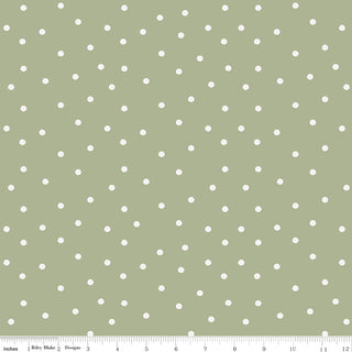 Riley Blake Sunflower Whispers by Lisa Audit Fabric C16673-GREEN features an olive green background with evenly spaced small white polka dots, a measurement ruler along the bottom edge, and is made from 100% cotton.