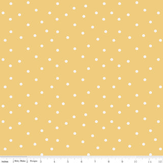 Riley Blake Sunflower Whispers by Lisa Audit Fabric C16673-YELLOW features a yellow background with small white polka dots, shown with a ruler in inches (0–12) for scale. Made from 100% cotton, by Fabric by Riley Blake.