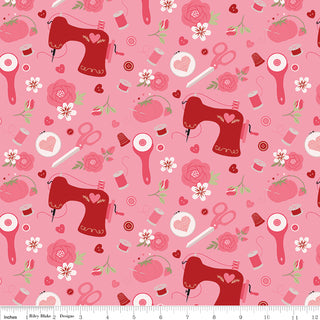 Sew in Love Dani Mogstad for RBD Rose Sewing Yardage C16901-ROSE by Fabric by Riley Blake: Pink cotton fabric with red sewing machines, scissors, buttons, thread spools, flowers & hearts; ruler on bottom edge. 44/45" wide, free shipping.