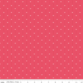 Sew in Love Dani Mogstad for RBD Pink Stripes Yardage C16904-PINK by Fabric by Riley Blake features red cotton with small pink hearts in vertical lines. This 44/45" wide fabric ships free and is shown with a 0–12 inch ruler for scale—perfect for your next project!.