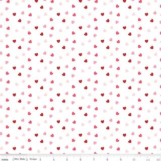 Sew in Love Dani Mogstad for RBD White Hearts Yardage C16905-WHITE by Riley Blake features small red, pink, and light pink hearts on white 44/45" wide cotton fabric, with a measurement grid along the bottom edge.