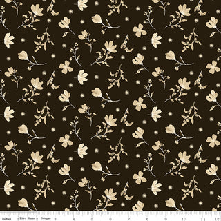 Riley Blake Morning Latte Floral Espresso C16921-ESPRESSO features small beige flowers and leaves on a dark brown background, shown with a measurement ruler. 100% cotton fabric by Riley Blake.
