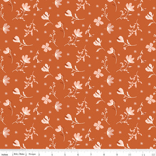 Riley Blake Morning Latte Floral Spice C16921-SPICE fabric by Riley Blake features orange cotton with scattered light pink floral silhouettes and small blossoms. A ruler at the bottom shows inch measurements. 100% cotton.