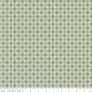 Riley Blake Morning Latte Tile Aloe C16922-ALOE features a repeating diamond and gold floral pattern on light green 100% cotton fabric; inches are marked by a ruler along the bottom edge. Brand: Fabric by Riley Blake.