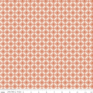 Repeating geometric orange and cream pattern on peach, with ruler for scale. Riley Blake Morning Latte Tile Pink C16922-PINK fabric by Fabric by Riley Blake, 100% cotton.