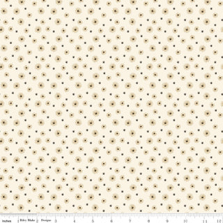 Riley Blake Morning Latte Seedpods Latte C16924-LATTE fabric features cream cotton with small brown sunburst shapes and a 0–12 inch ruler for scale. From Fabric by Riley Blake, sold by the yard.