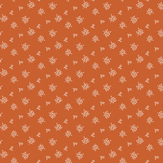 Small white floral clusters dot the burnt orange Riley Blake Morning Latte Ditsy Spice C16926-SPICE fabric, creating a simple repeating pattern on premium 100% cotton by Fabric by Riley Blake.