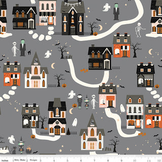 The Frank and Friends HOUSES GRAY C17471-GRAY premium cotton by 56-Riley Blake features Halloween houses, ghosts, skeletons, pumpkins, bats, and trees on gray with winding white paths—ideal for quilting projects.