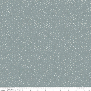 Leo & Savannah by Deena Rutter C17546-BLUE Terrain Blue Fabric Yardage from Fabric by Riley Blake is a 44" wide, light grayish-blue cotton quilting fabric with small white triangles and dots. Ruler along bottom shows inches 0-12. Sold by the yard.