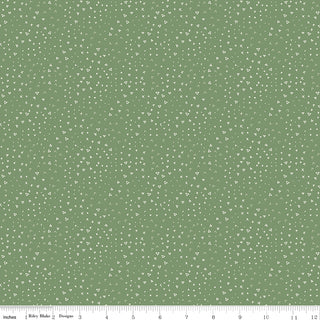 Leo & Savannah by Deena Rutter Terrain Green fabric from Riley Blake features scattered white triangles, dots, and lines on green cotton; 44" wide and sold by the yard. Includes inch ruler along bottom for reference.