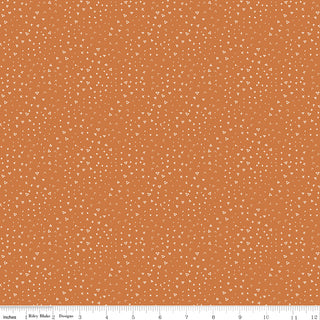 Leo & Savannah by Deena Rutter C17546-ORANGE Terrain Orange Fabric Yardage from Riley Blake; 44" wide cotton fabric featuring a scattered pattern of small white geometric shapes—circles, triangles, and squares—shown with a ruler for scale.