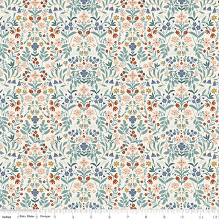 Featuring a repeating floral pattern with blue, red, yellow, and green flowers and leaves on a light cream background, the Danelys Sidron for RBD Before the Bloom C18064-CREAM Iris Cream premium cotton fabric by 56-Riley Blake is shown with an inch ruler for scale. This high-quality fabric is perfect for your next quilting project.
