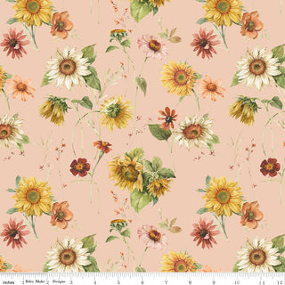 Riley Blake Sunflower Whispers by Lisa Audit—CD16670-BLUSH features sunflowers and wildflowers in yellow, orange, and pink on a pale peach blush cotton fabric. Includes ruler at bottom for scale. Quality by Fabric by Riley Blake.