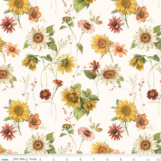 Riley Blake Sunflower Whispers by Lisa Audit, CD16670-CREAM, features watercolor sunflowers and wildflowers with green leaves on cream cotton. Includes a ruler scale along the bottom edge. 100% cotton from Fabric by Riley Blake.