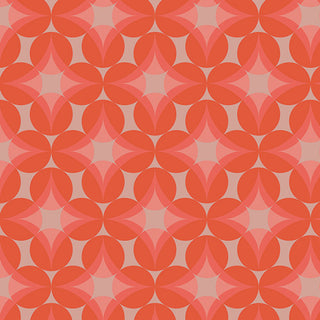 Glass Grapes CMT-62903 by Dana Willard for AGF Cinnamon Toast from 69-Art Gallery Fabrics features a repeating geometric pattern with overlapping red-orange petal shapes forming circular and star-like designs on a light pink background, available as cotton fabric by the yard.