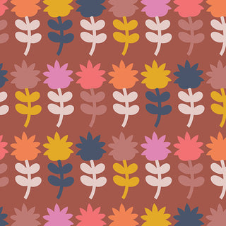 The Mini Dutch Bloom CMT-62907 by Dana Willard for AGF Cinnamon Toast, from 69-Art Gallery Fabrics, features a repeating pattern of stylized flowers arranged in rows. Petals in shades of pink, yellow, orange, blue, and brown decorate a rich reddish-brown background. This delightful design is printed on soft cotton fabric and is available by the yard.