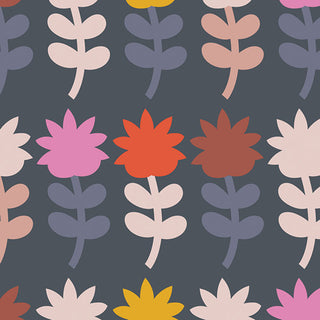 Dutch Bloom Sugar CMT-62911 by Dana Willard for Art Gallery Fabrics features a repeating pattern of stylized, colorful flowers in pink, red, yellow, brown, and white with simple leaves on a dark gray background. This vibrant design is perfect for cotton fabric projects and is available by the yard from 69-Art Gallery Fabrics.