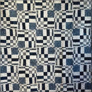 Join the 1000-Education Delusional Quilt Class (4th Thursday each month) to create a quilt top featuring an eye-catching geometric pattern in blue, gray, and white—ideal for beginner sewists seeking a fun, approachable project.