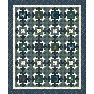 A rectangular quilt featuring a geometric pattern in shades of blue, green, and white, with certain squares showcasing Christmas designs such as trees, ornaments, and festive texts from Sew & Vac's 'Deco The Halls' fabric collection by Jennifer Ellory. The border is dark blue adorned with small stars.