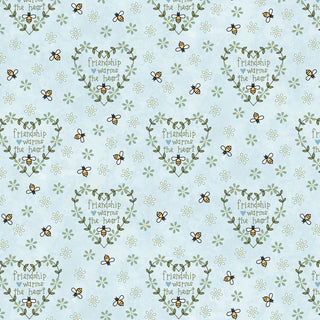 Friendship Garden Gail Pan for HGF 3629-17 FRIENDSHIP HEARTS Light Blue Fabric Yardage by 47-EE Schenck features a lovely light blue background adorned with delicate flowers, bees, and green heart-shaped wreaths framing the phrase “Friendship warms the heart,” repeated across the surface. This charming cotton fabric is ideal for your next project—and includes free shipping.