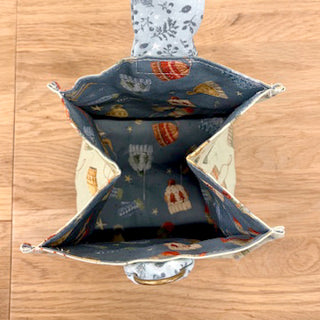 Join the Layton In-Store Class: “THE GIVING BAG” Reusable Gift Bag with four compartments and patterned lining. Perfect for beginners or as inspiration! Class with Carla on 12/6/25, 1–4 PM.