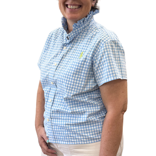 A person wearing the “Men’s Shirt Refashion SAT SEPT 26 1-4 PM Layton Location Only” by Layton In-Store Class, featuring a light blue and white checkered pattern with a ruffled collar, stands against a plain white background, highlighting classic style reimagined with a modern touch.