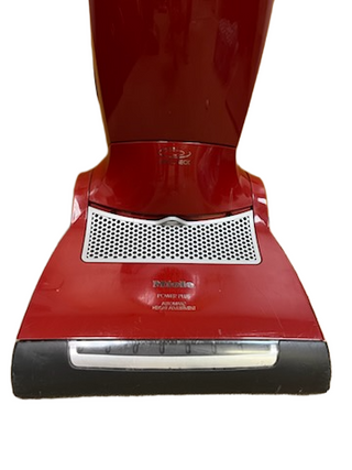 The Miele Dynamic U1 Fresh Air PowerLine upright vacuum by Imagine Sewing & Vacuum features a red body, black base, silver vent, and AirClean filters, shown front-facing against a white background.