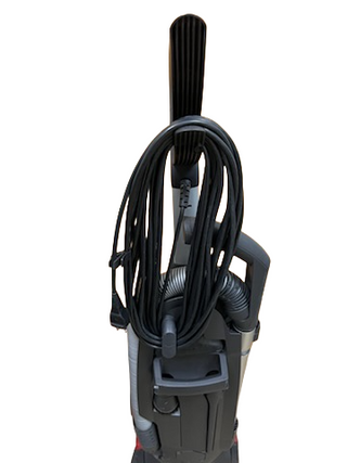 Refurbished Miele Dynamic U1 Fresh Air PowerLine upright vacuum from Imagine Sewing & Vacuum, shown from the back with AirClean filters, coiled power cord, and hose against a white background.