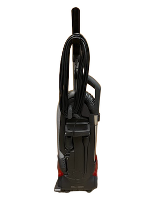 A refurbished Miele Salsa Upright from Imagine Sewing & Vacuum, shown from the back with its cord neatly wrapped, cleaning attachments secured on board, and new filters installed for top performance.