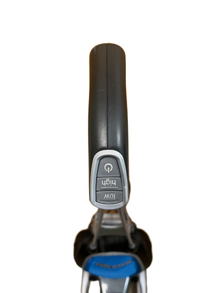 Close-up of an electric scooter throttle with “power,” “high,” and “low” buttons, photographed from above against a white background—reminiscent of the dependable cleaning controls on the Oreck Magnesium by Imagine Sewing & Vacuum.