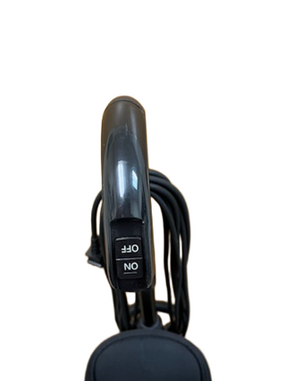 Close-up of the black handle on the Oreck Elevate Control by Imagine Sewing & Vacuum, showing the ON/OFF switch and coiled power cord.