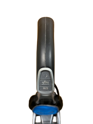 Top view of an Oreck Magnesium vacuum handle with a "Low" and "High" control, similar to adjusting an exercise bike for optimal cleaning performance. Available at Imagine Sewing & Vacuum.